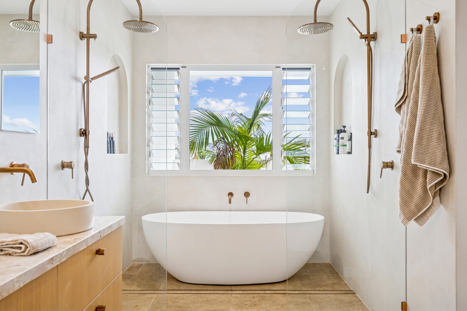 Spa bathroom with freestanding tub and bronze tapware