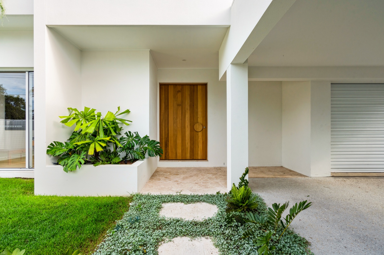 Timber pivot entry with greenery