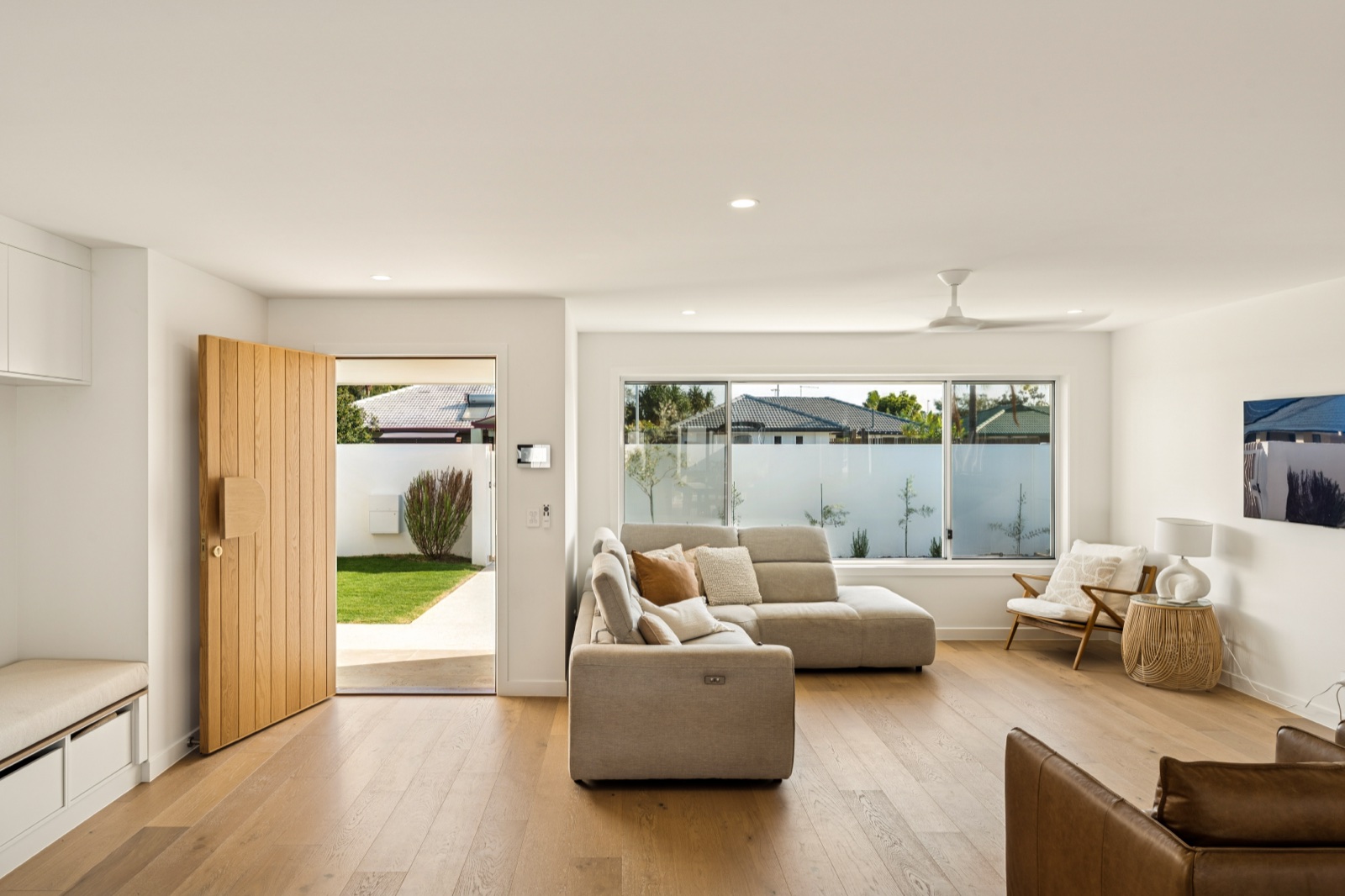Living room with timber pivot door to the yard